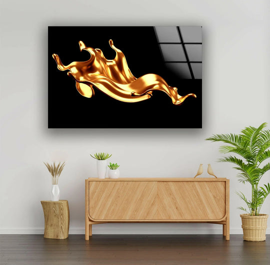 A luxurious gold splash against a stark black background for art from glass.