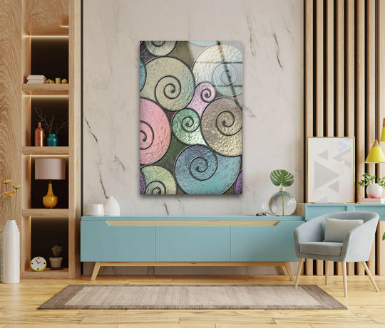 A cool-toned abstract glass wall art piece with swirling geometric patterns, adding a touch of serene home decor.
