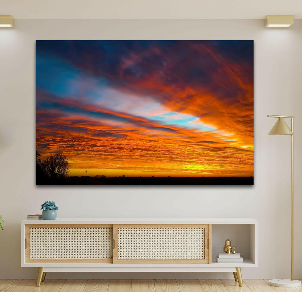 Breathtaking cloudscape with vibrant hues of a fiery sunset.
