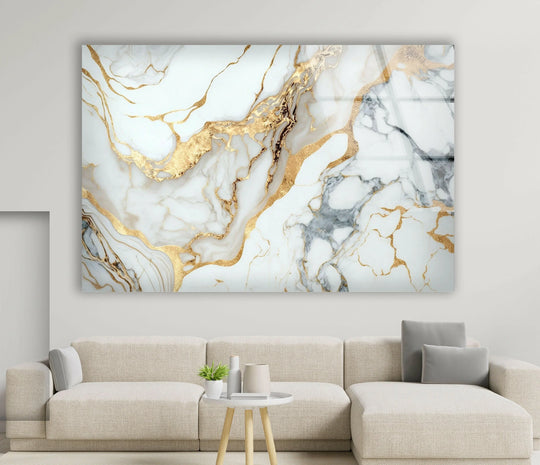 A cool-toned abstract wall art print features crisp white marble veined with luminous, warm gold accents.