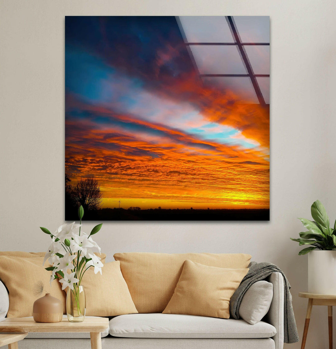 A captivating sunset with intense orange and red hues reflecting across the sky.
