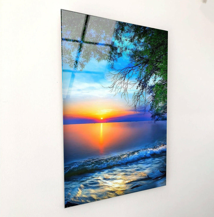 Tranquil beach scene with vibrant sky colors and soft rippling water, printed on glass.
