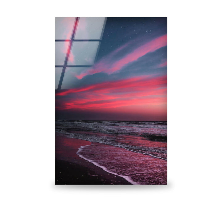 Serene seascape featuring a vibrant dusk sky and gentle waves on glass wall art.
