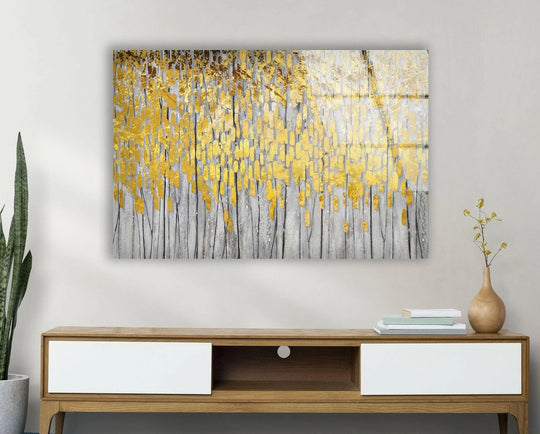 This abstract glass art evokes a luxurious and elegant mood with its shimmering golden leaf accents against a textured grey background.