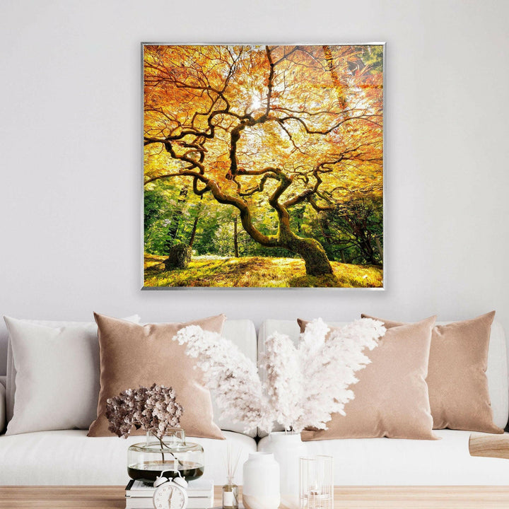 Elegant glass wall art featuring a mesmerizing autumn tree and rich seasonal hues.
