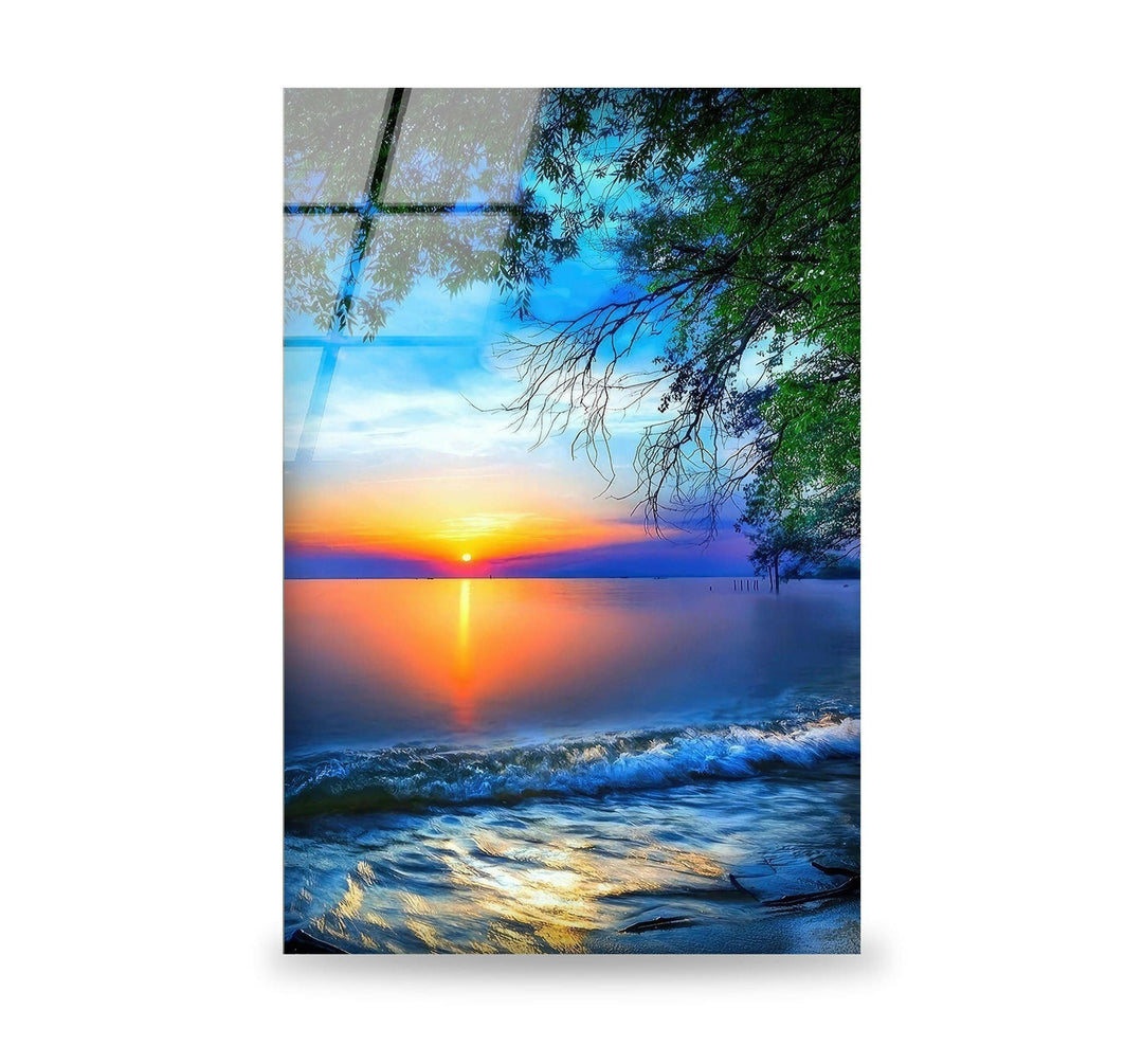 Breathtaking sunset over calm ocean waves, captured in high-quality glass wall art.
