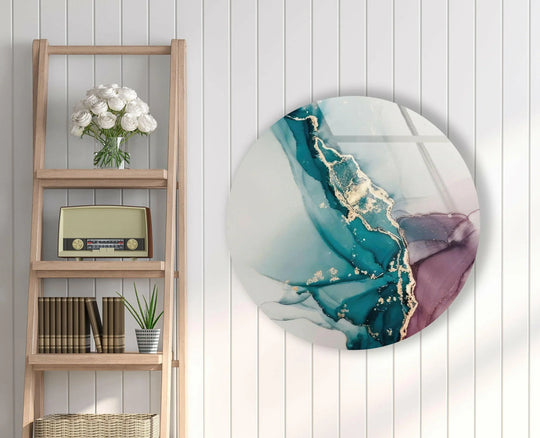 Alcohol ink round glass wall art showcases swirling teal and purple layers with shimmering gold accents, creating depth in decorative wall art.
