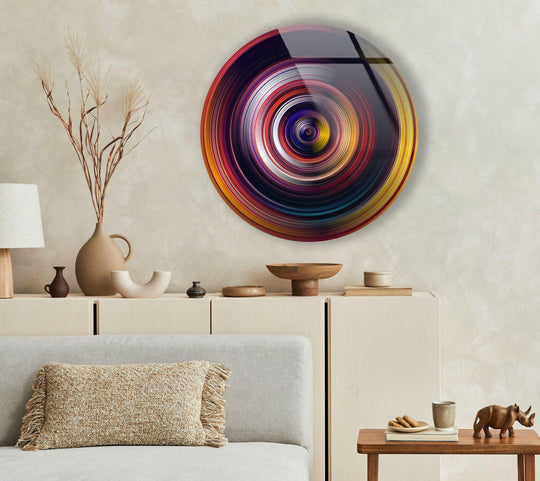 Dominant shades of yellow, red, and black swirl vibrantly in this round glass hanging wall art, creating a dynamic and modern focal point.