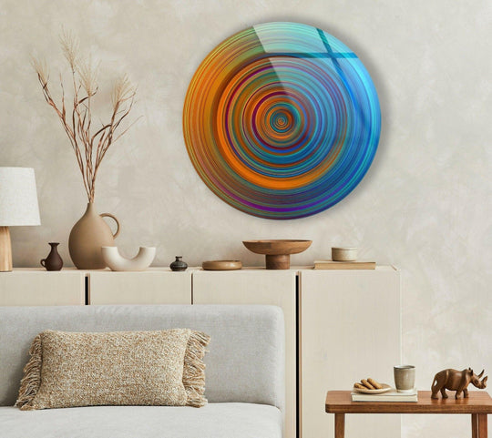 Illuminating depth and layers, this blue circles abstract round glass wall art features a mesmerizing, spiraling design in this stunning glass art painting.