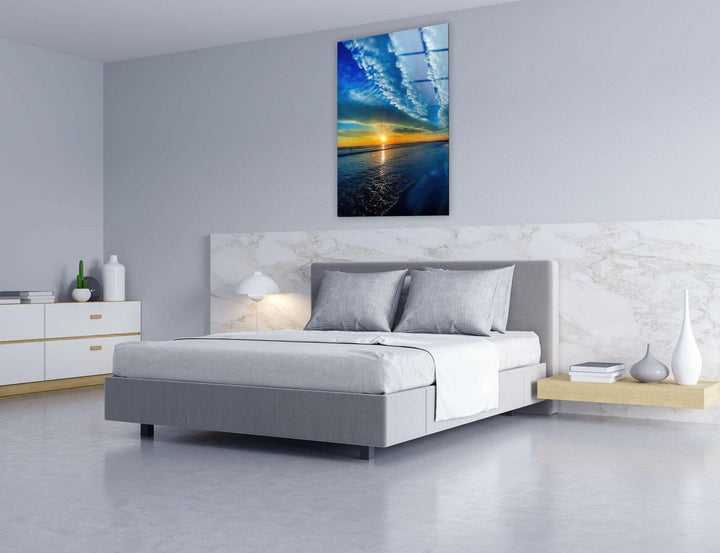 Modern wall art showcasing a peaceful yet dramatic ocean sunset scene.
