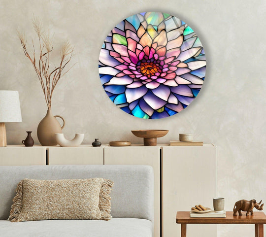 Geometric shapes form the unique modern wall decor in this round glass wall art, displaying a pink flower with stained glass details.
