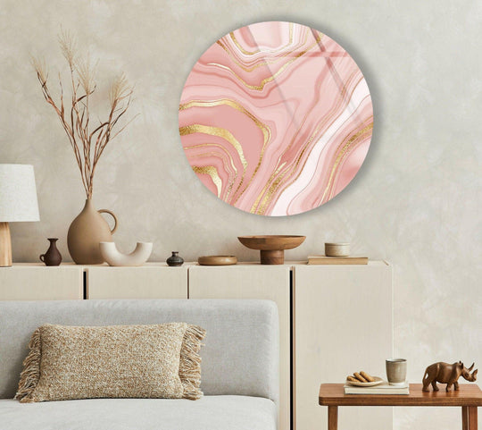 Warm color temperature emanates from the pink abstract with gold details round tempered glass wall art, casting a cozy glow upon the surrounding decor.