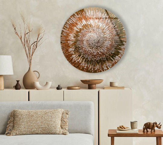 Negative space surrounds the radial patterns in orange spiral abstract round glass art, highlighting its unique dimension as a piece of glass art.