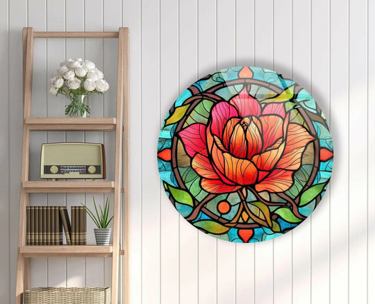 Depicting the loudest element of the stained round red rose, this glass wall artwork features vibrant colors that bring elegance to any modern space.
