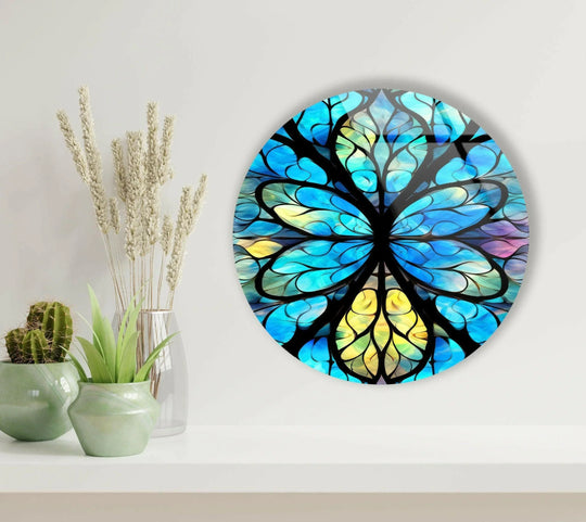 Featuring a stained finish, this round blue mandala glass wall artwork displays vivid hues on tempered glass.