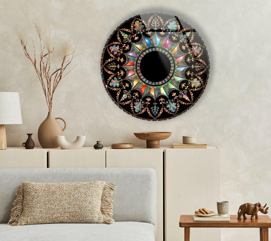 Featuring the brightest radiating colors of the Black Mandala Round Glass hanging wall art, this circular art piece adds an elegant touch with vibrant patterns.