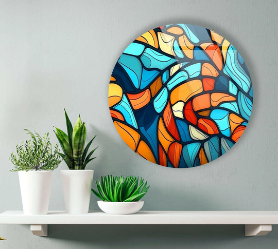 Flowing organic forms create an abstract mosaic with this eye-catching blue and orange round glass art painting.