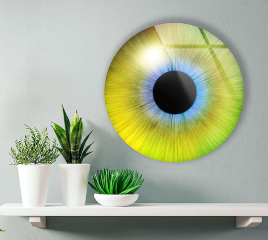 Warm tones emanate from the vibrant yellow and green Colored Green Eye round hanging wall art, creating a bright and inviting focal point.
