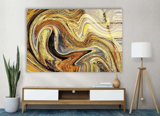 A mesmerizing transition of gold, black, and cream hues flows through this abstract hanging wall art.
