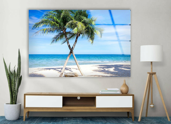 Luxury glass print capturing a tropical paradise with warm sand, ocean waves, and vibrant greenery.
