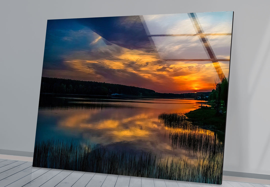 Golden Twilight Beauty: A breathtaking landscape art print on glass, showcasing a vibrant sunset reflecting over a serene lake.


