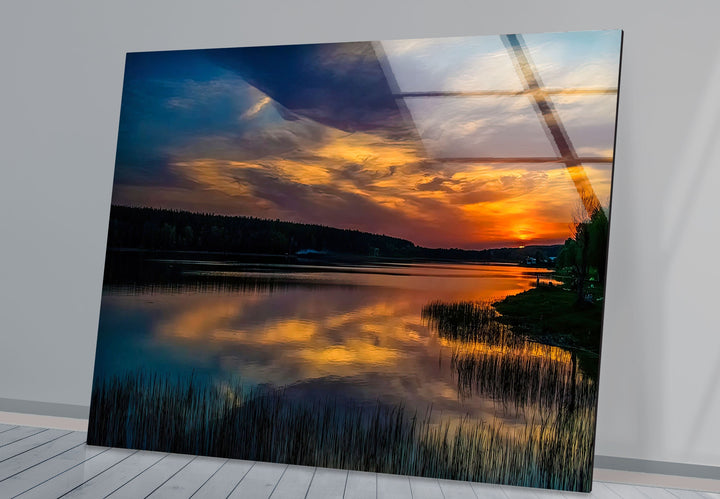 Golden Twilight Beauty: A breathtaking landscape art print on glass, showcasing a vibrant sunset reflecting over a serene lake.

