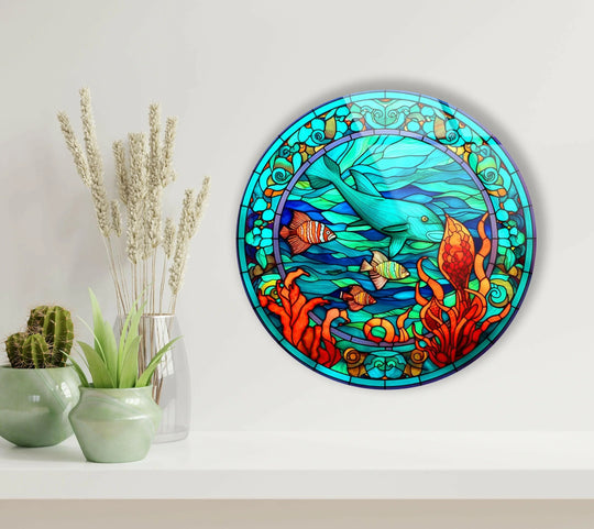 Showing the realistic detail of the stained dolphin and fish round art from glass, the piece evokes an underwater scene with vibrant colors and intricate patterns.