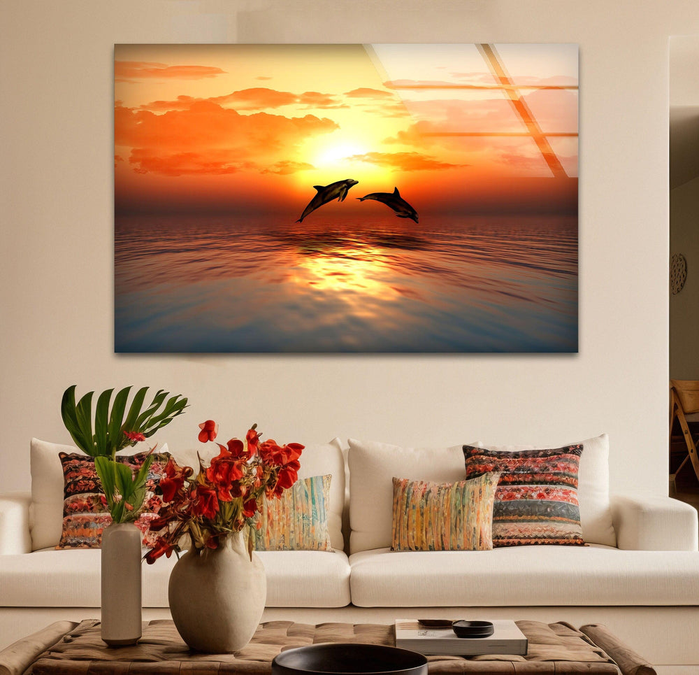 Breathtaking view of dolphins at sunset, creating a peaceful ocean scene.
