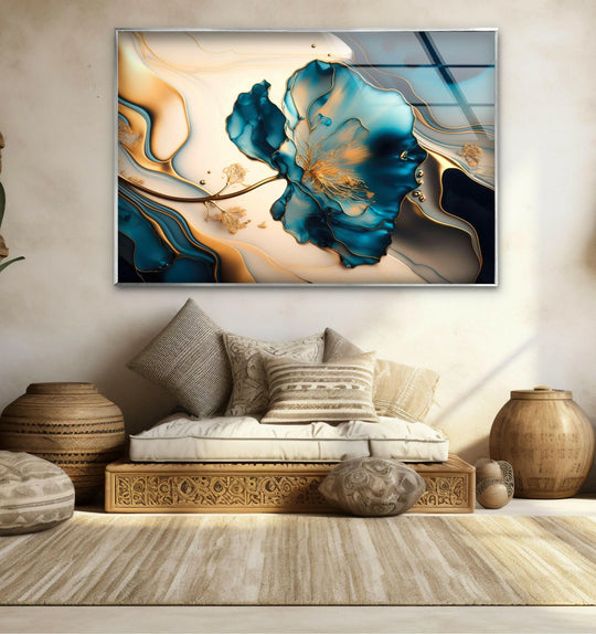 A dominant blue marble flower glass wall art with gold accents and abstract navy and beige waves.