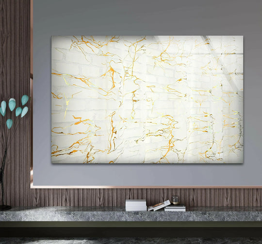 Striking white marble with contrasting vibrant gold waves, a stunning piece of glass art.