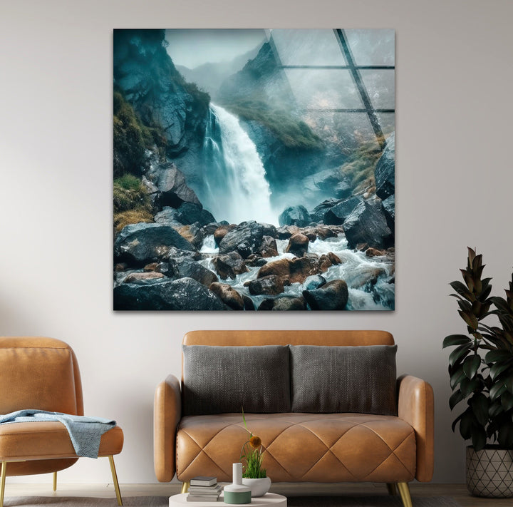 Serene nature scene of a majestic waterfall shrouded in mist, an elegant glass wall art piece.
