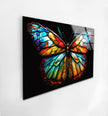 a painting of a colorful butterfly on a white wall