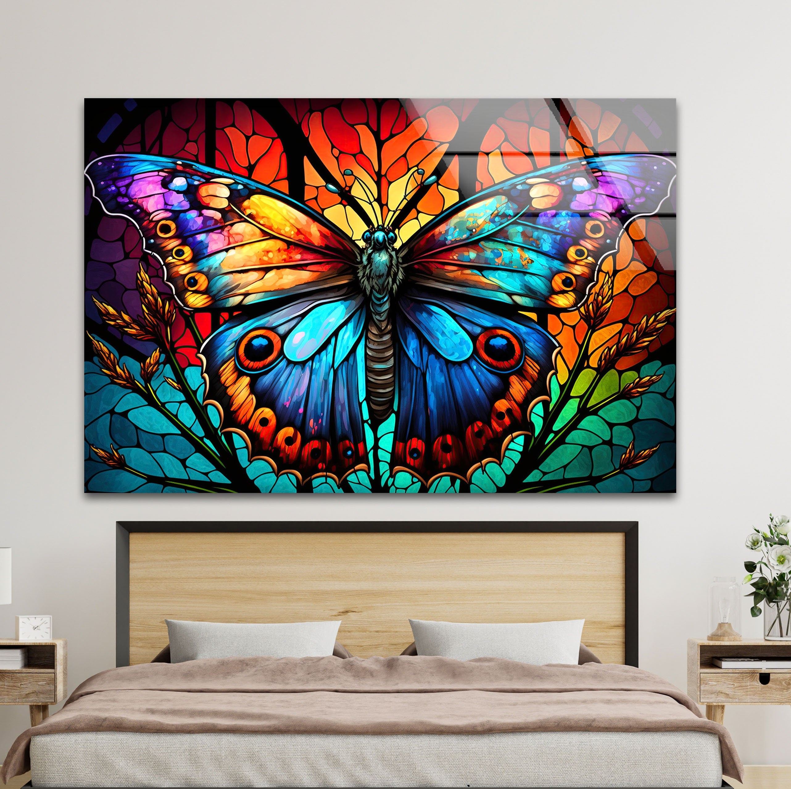 a colorful butterfly painting on a wall above a bed