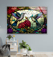 a picture of a stained glass window with two hummingbirds