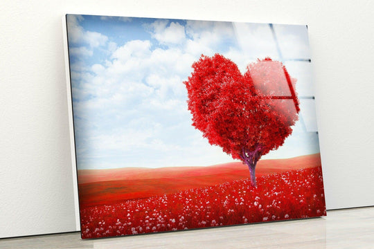 A glossy, reflective surface texture of a red heart-shaped tree in a field adorns this hanging wall art.