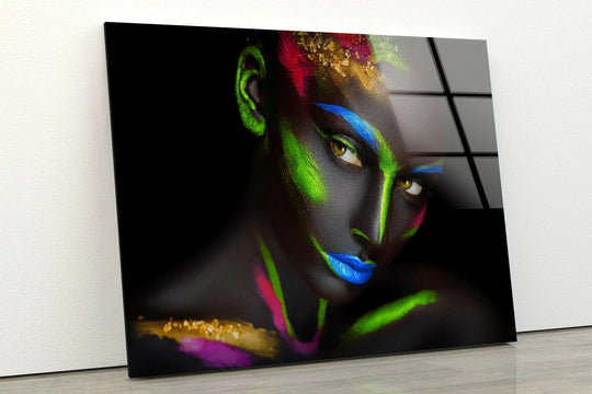 Striking blue lips and neon green streaks dominate this bold glass wall artwork.
