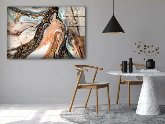 Swirling gold and pink marble patterns create mesmerizing abstract glass art with a luxurious, fluid aesthetic.