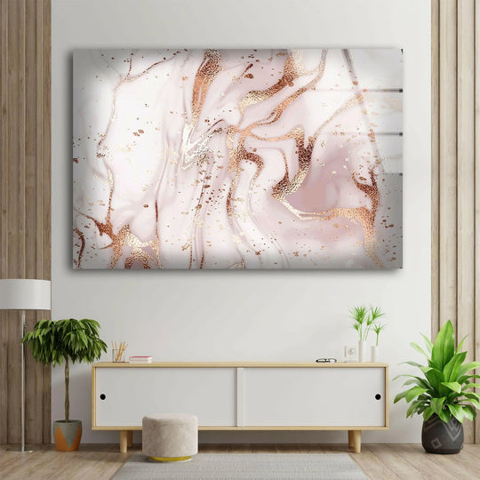 Subtle light catches the swirling pink and gold marbling of abstract art from glass, creating soft shadows.