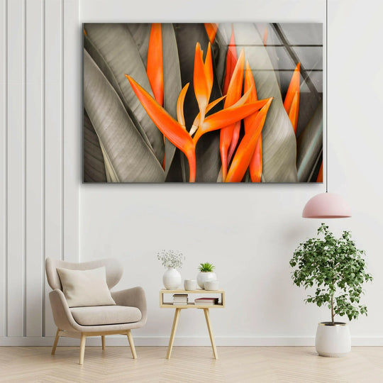 A warm color temperature highlights the vibrant orange heliconia flower in this unique modern wall decor glass art.