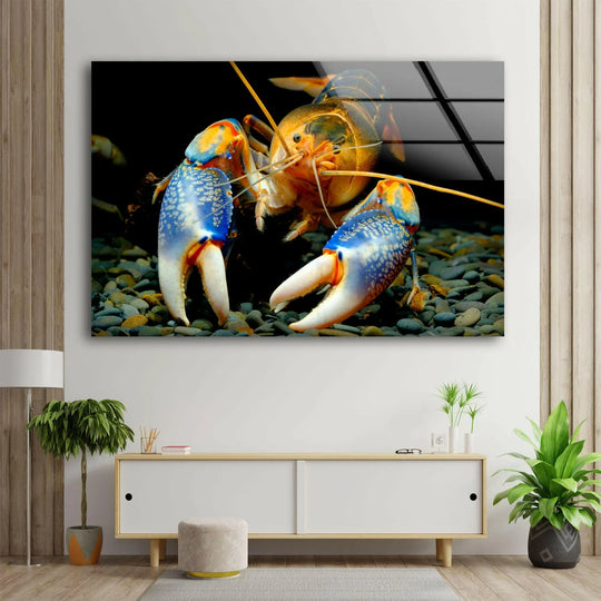 A close-up shot of a vibrant blue and orange lobster on a pebbled seabed, showcased as art from glass.