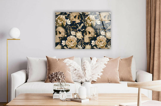 A cool glass art print with geometric skulls and floral patterns displayed above a sofa.