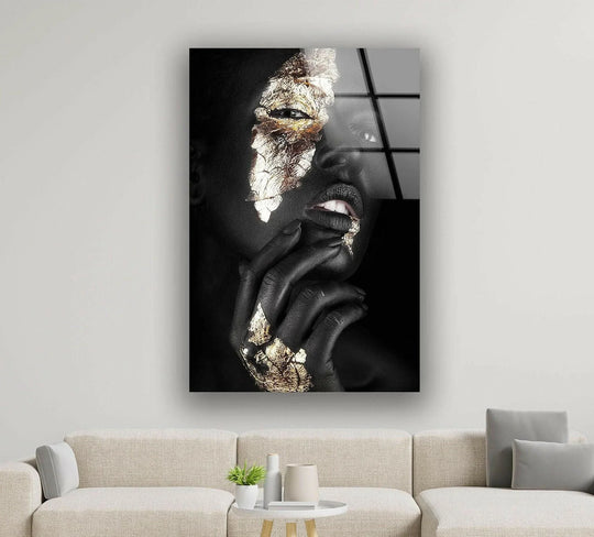 A close-up of a gold and black woman portrait glass wall art, highlighting the sharp edges and clear border of the artwork.