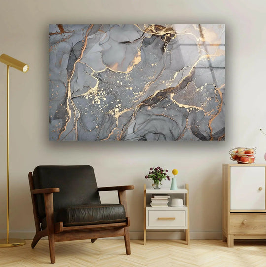 Dominant grays and golds swirl across this abstract hanging wall art, mimicking luxurious marble.