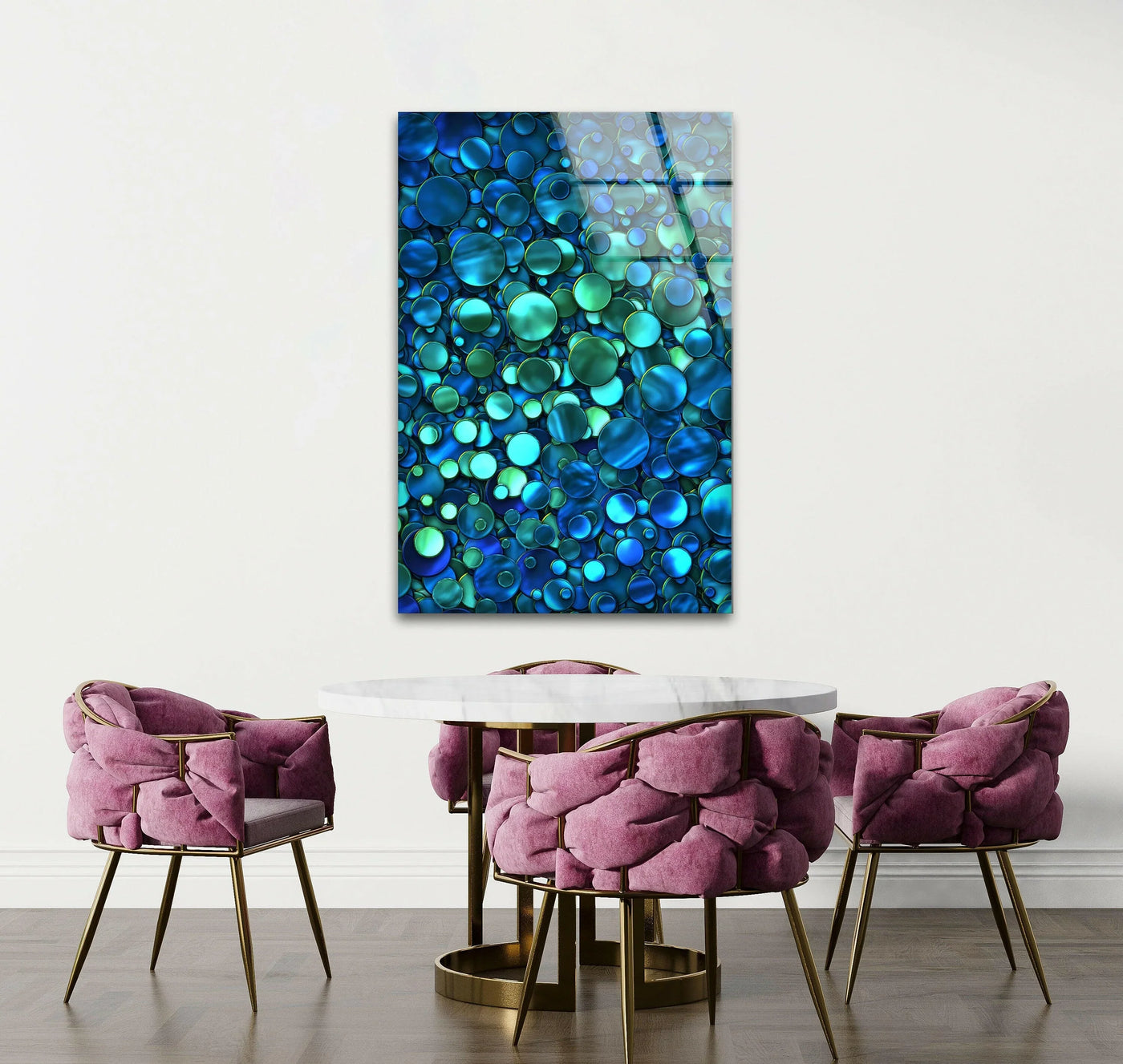 Stunning blue bubbles abstract glass art creates a vibrant focal point on a white wall above a round marble dining table.