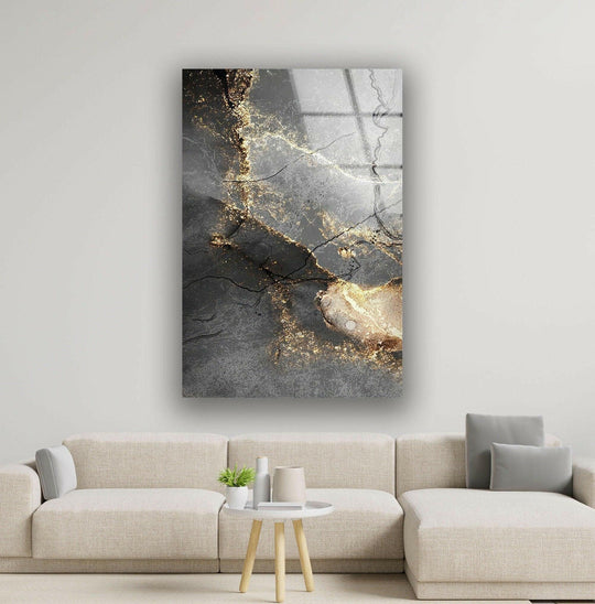 Cool gray tones contrast with warm, golden hues in this abstract glass wall artwork.