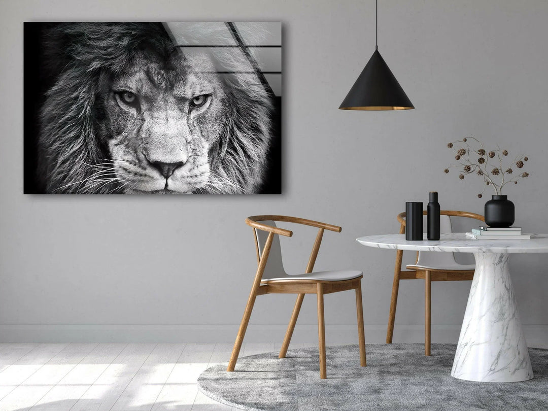 Black and white wildlife glass art featuring a strong, detailed lion portrait.