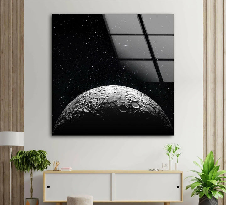 Realistic moon horizon with rugged craters set against twinkling stars printed on glass art.