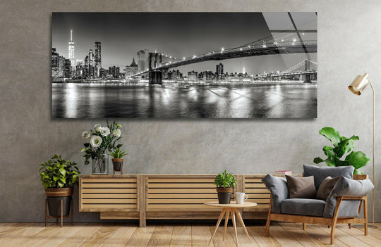 Brooklyn Bridge black and white glass wall art showcases a city skyline and bridge lights and offers modern wall decor for a living room