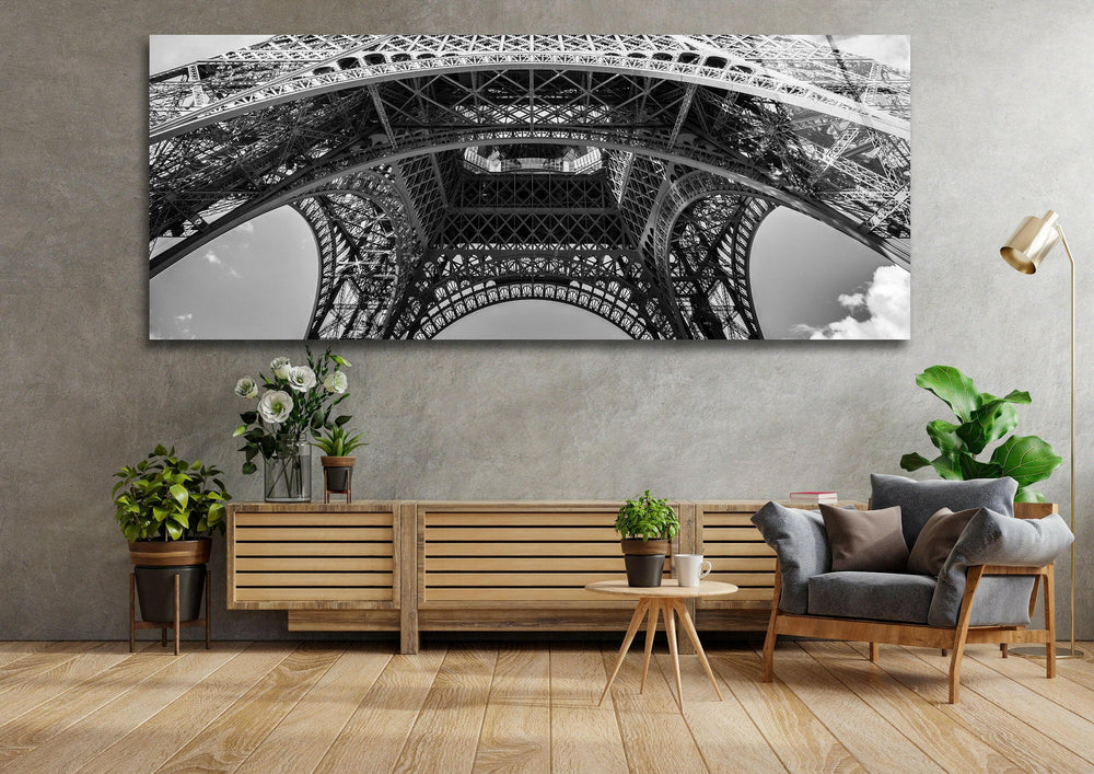 Monochrome Eiffel Tower close-up showcasing intricate ironwork on modern glass wall art.