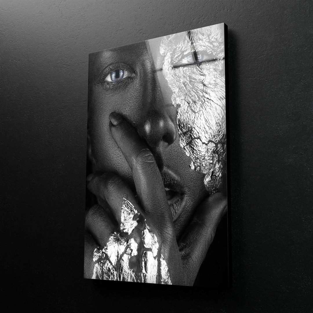 Unique monochrome face artwork with textured silver patterns and striking blue eyes.